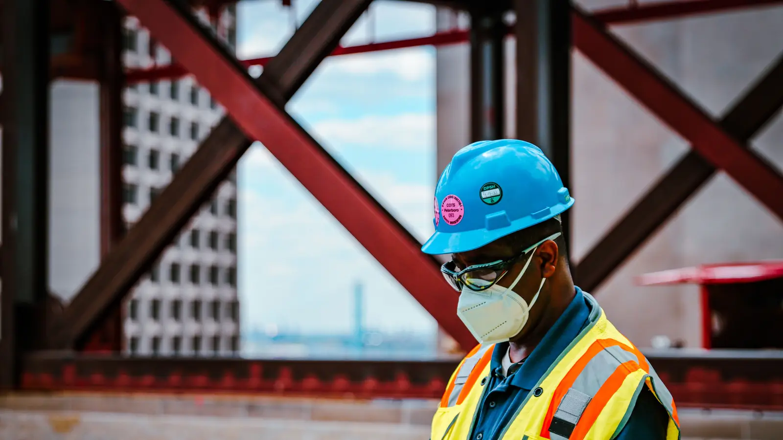 Contractor checking his phone on a construction jobsite