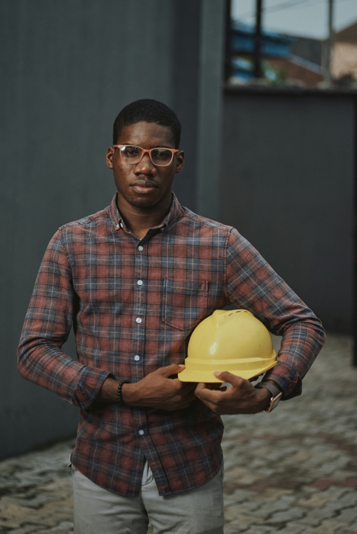 Roofing operator inspecting a failing website's mobile load behavior on a phone in a workshop