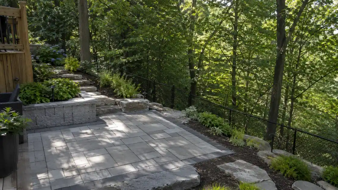 Landscaped GTA backyard on a ravine grade with a retaining wall