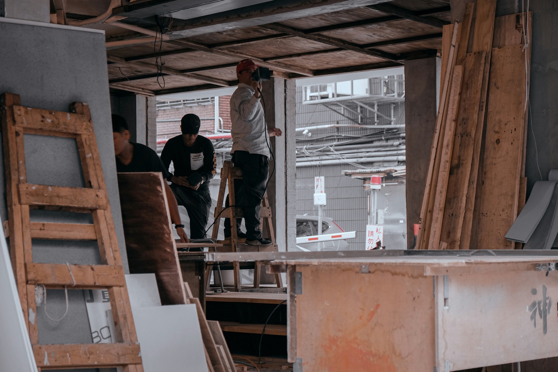 Renovation crew framing interior walls during kitchen remodel