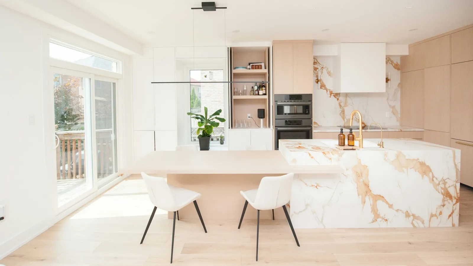 Remodeling contractor installing cabinetry during a kitchen renovation