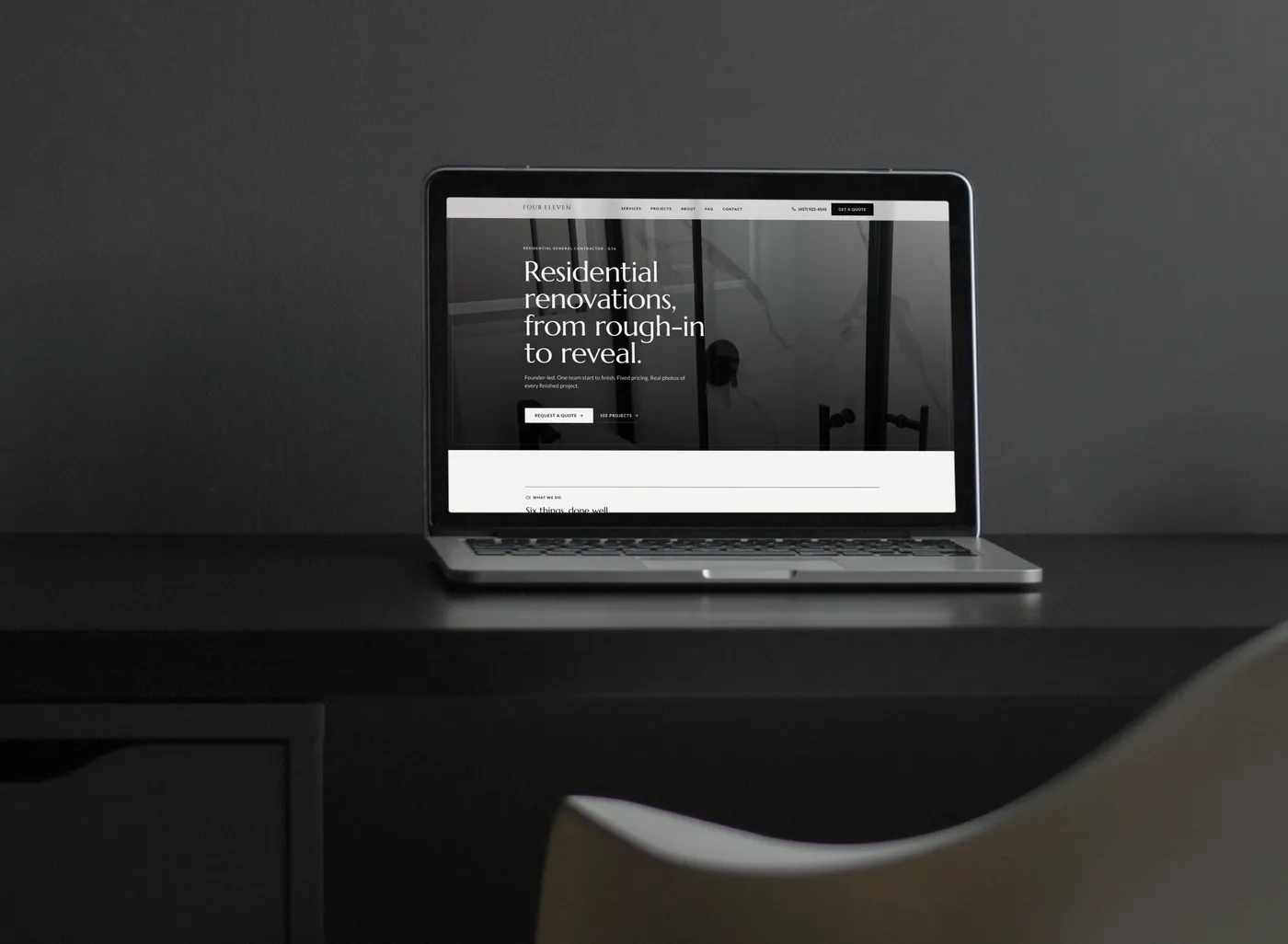 The Four Eleven Contracting website Fervor built, shown on a laptop