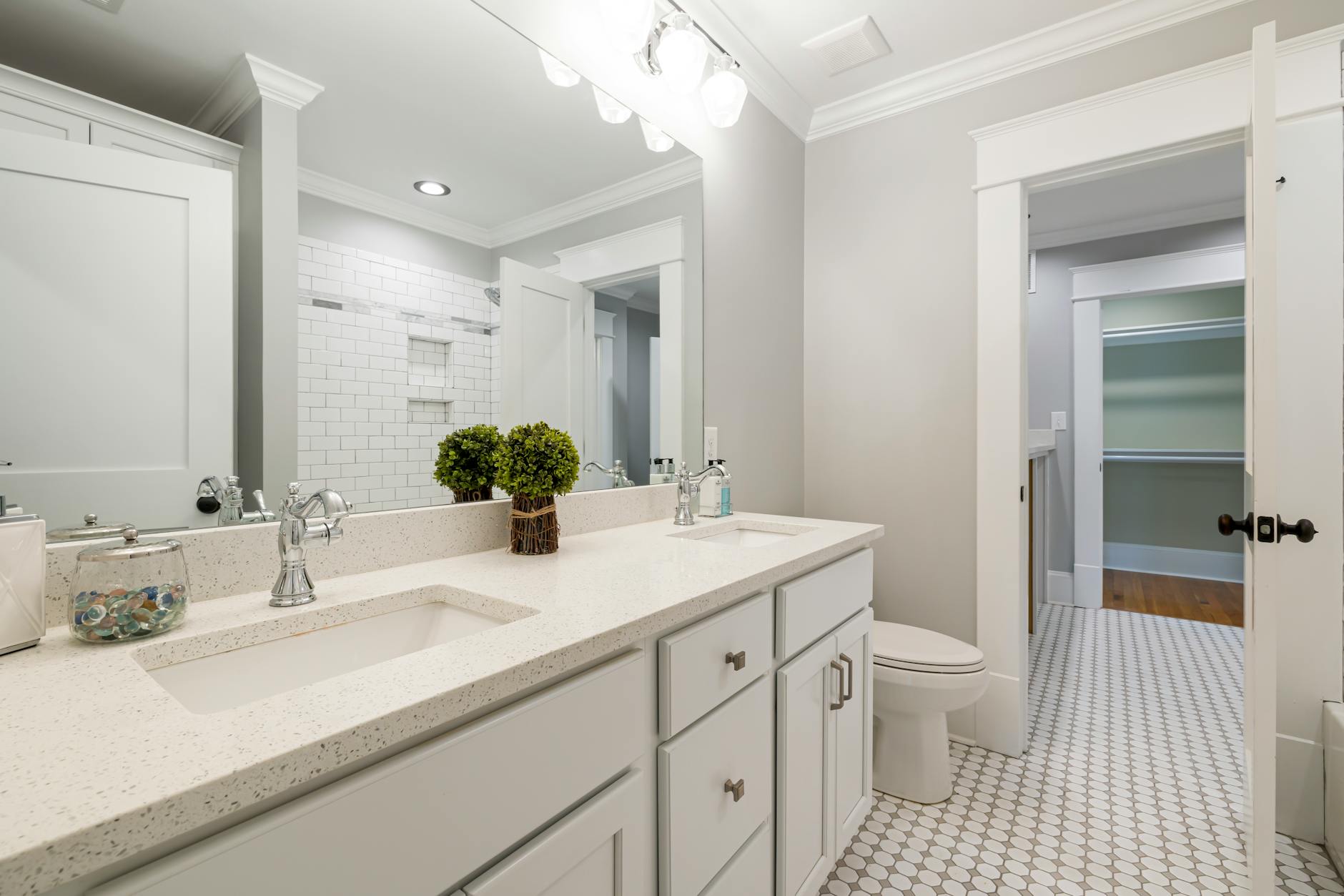 Bright and spacious modern bathroom with white fixtures and minimalist decor.