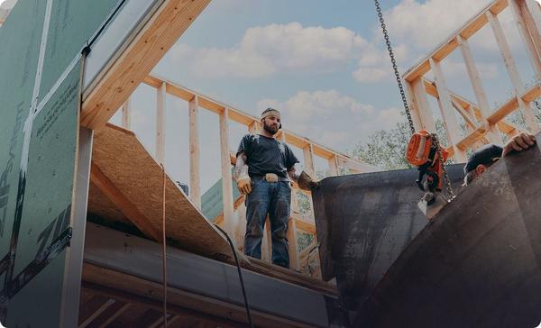 Custom home builder framing a house on a jobsite